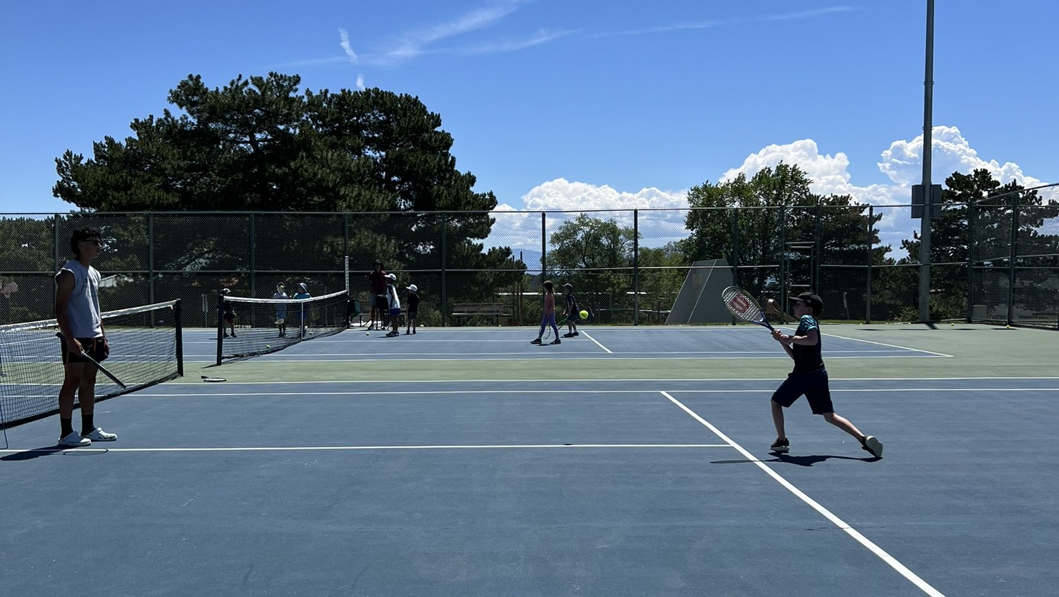 Child participating in tennis or youth sports